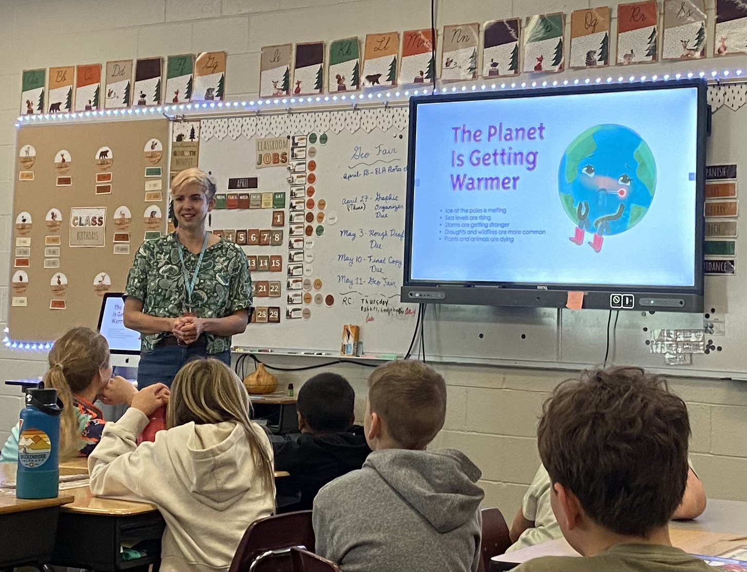 Mel presents Love the Earth in a classroom